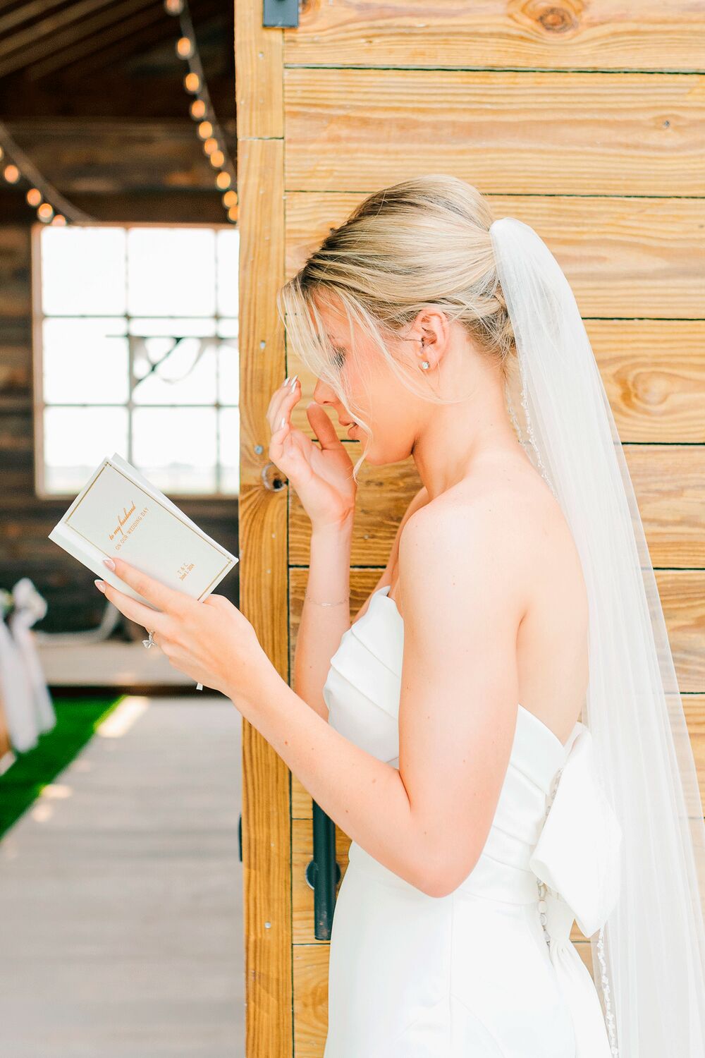 Bride reading a letter before the ceremony