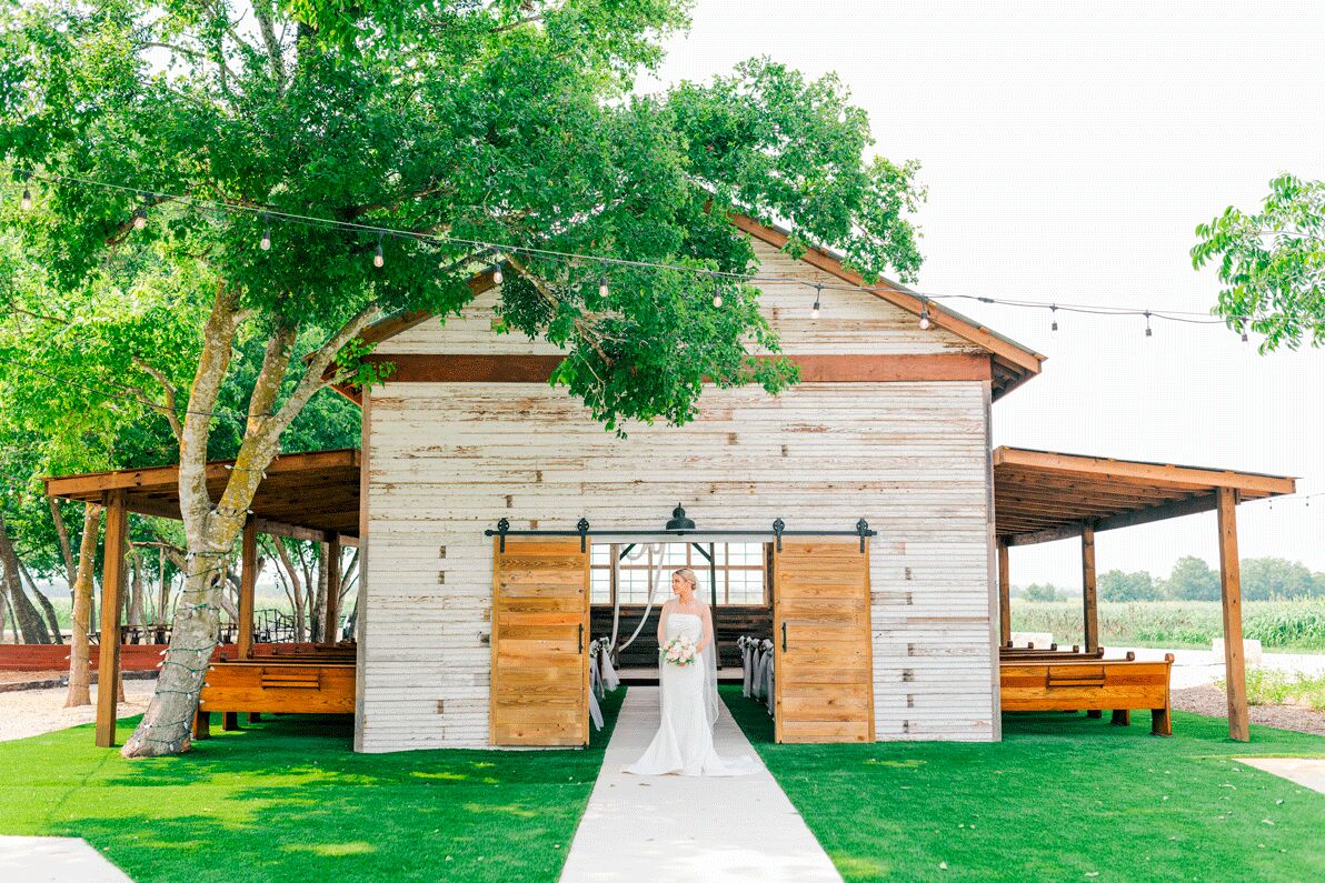 Bride walking out of the chapel's sliding barn doors