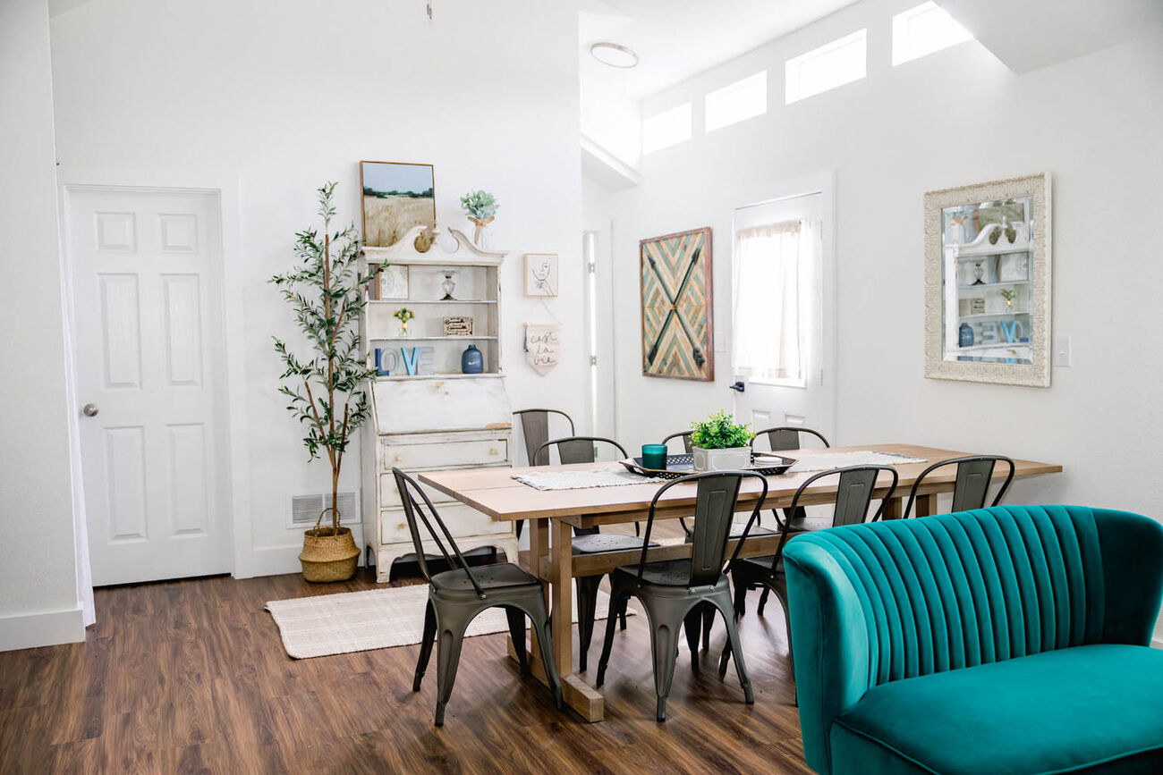 Bright guesthouse dining area with a long table